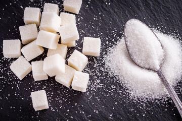 sugar refined on a dark stone background