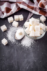 sugar refined on a dark stone background