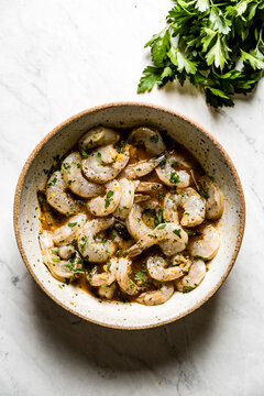 Shrimp in a homemade marinade, on a marble background