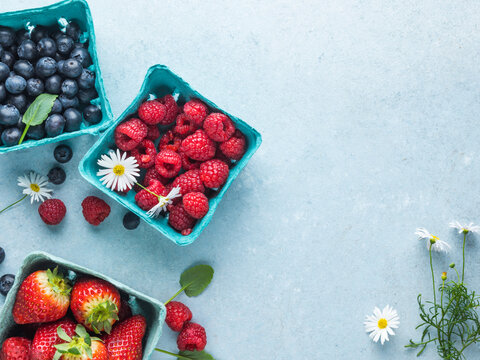 Strawberry, Raspberry, Blueberry Fruits On A Blue Background