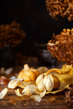 Smoked garlic on a wooden table