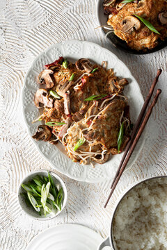 Egg Foo Young with Rice and chopsticks