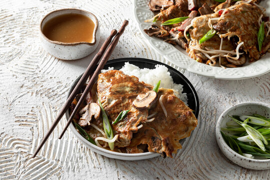 Egg Foo Young with Rice and chopsticks