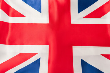 Fototapeta premium top view of british flag with red cross
