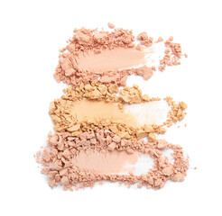 Swatches of different crushed face powders on white background, top view