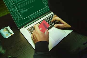 Close up of programmer of hacker hands typing a code