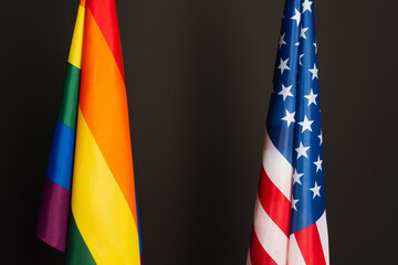 american and colorful lgbt flags isolated on black