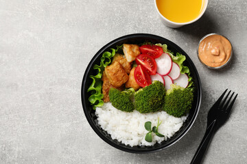 Healthy takeaway meal served with sauce and juice on light grey table, flat lay. Space for text