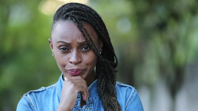 Judgemental African woman emotion. Portrait skeptical black person