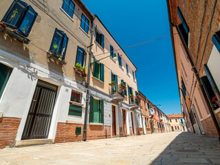 Fototapeta na wymiar Venezia tight and old architecture Fassade shapes with blue sky background