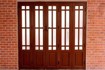 Accordion doors with the old style wooden lock.
