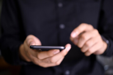 Close up of man using mobile phone.