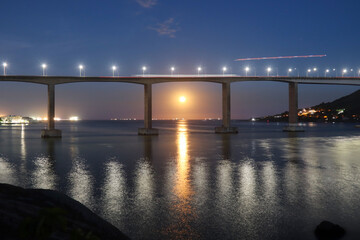 bridge at night with moon