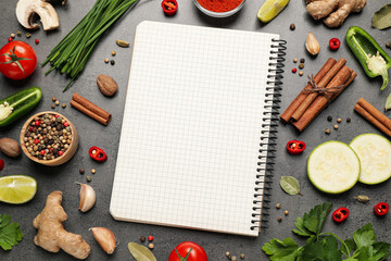Blank recipe book and different ingredients on grey table, flat lay. Space for text - obrazy, fototapety, plakaty