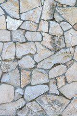 stone wall made of sandstone blocks of different sizes as the background