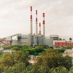 Fototapeta na wymiar A power plant with with smoke stacks, seen from the Ed Koch Queensboro Bridge, New York City