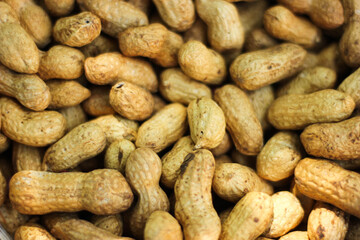 Cup of peanuts as background