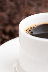 Coffee mug isolated on coffee background