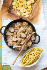 Dinner set; Pork loin chops with leeks, roasted potatoes with oregano and yellow beans with butter 