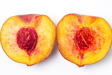 Naklejka na ściany i meble Peaches on a white background. Peach cut in half. Healthy diet.