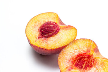 Peaches on a white background. Peach cut in half. Healthy diet.