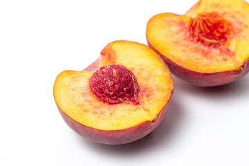 Naklejka na ściany i meble Peaches on a white background. Peach cut in half. Healthy diet.