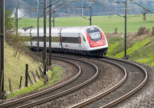 Swiss tilting train SBB ICN RABDe 500 rounds a curve at speed on April 20, 2021 in Niederbipp, Switzerland