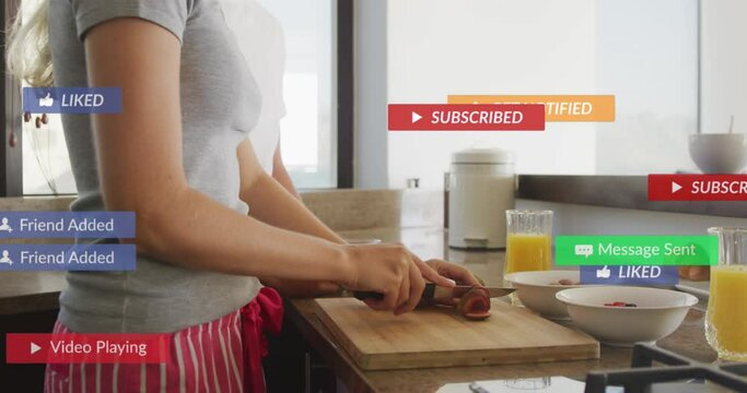 Animation of social media notifications over woman preparing breakfast in sunny kitchen
