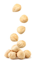 Peeled hazelnuts fall on a heap on a white background. Isolated