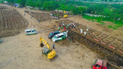Aerial view of Funeral procession at Rorotan, North Jakarta. Special graves infected with the corona virus with the Covid-19 protocol. (Covid-19 patient funeral). Jakarta, Indonesia, July 9, 2021