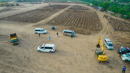 Aerial view of Funeral procession at Rorotan, North Jakarta. Special graves infected with the...