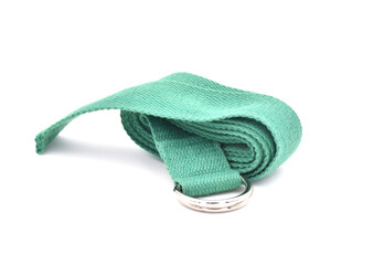 Cork yoga block and green strap isolated on a white background