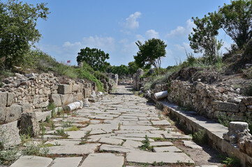 Fototapeta na wymiar An ancient Roman city street paved with powerful stone slabs