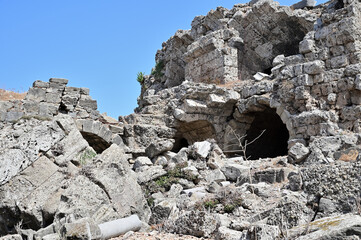 Ruins of an ancient Roman high building built of stone blocks