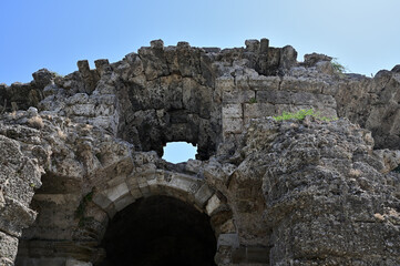 Fototapeta na wymiar Ruins of an ancient Roman structure of hewn stone blocks