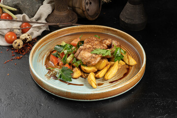 Chop with potato slices and salad