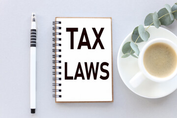 Tax law. the notebook lies on a gray background