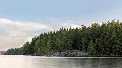 Long exposure photo of quiet Island on Finnish lake Päijänne