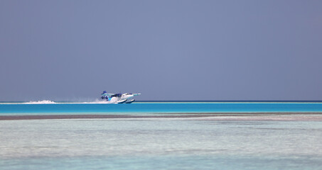 Seaplane gliding on sea water