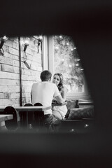 Fototapeta na wymiar guy and a girl meeting in a city cafe