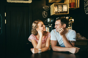 guy and a girl meeting in a city cafe