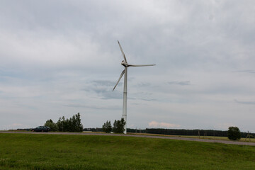 A wind generator, wind farm or wind turbine is a device for converting the kinetic energy of the...