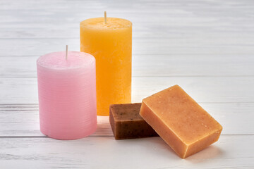 Natural handmade soap bars and candles for spa treatment.