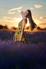 Obraz premium Young woman in blooming lavender field