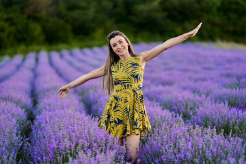 Young woman in blooming lavender field