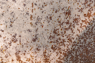 Rusty metal texture. Peeling paint on the rust wall.