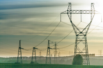 Industrial high voltage electricity line tower. Energy technology - obrazy, fototapety, plakaty