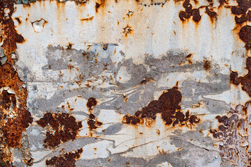 Rusty metal texture. Peeling paint on the rust wall.