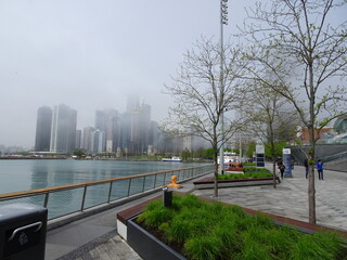 Downtown Chicago skyline in fog with waterfront
