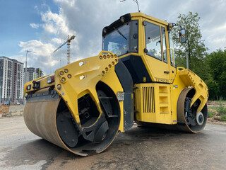 Fototapeta premium Construction site is laying new asphalt road pavement,road construction workers and road construction machinery scene.highway construction site landscape